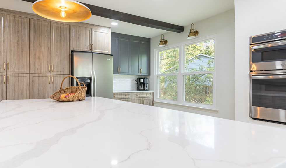 custom-rtf-cabinets-white-quartz-island-and-brass-hardware