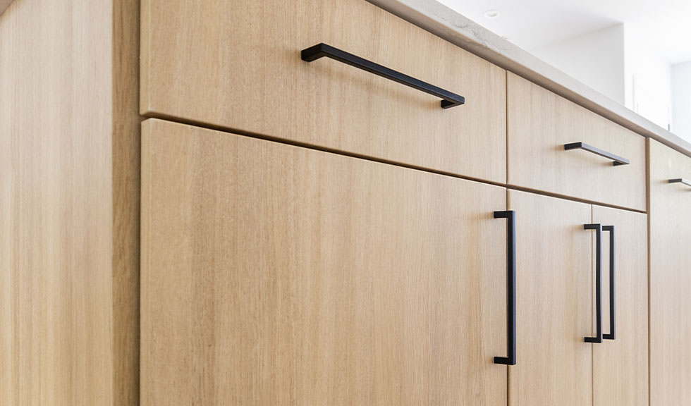 close-up-light-wood-rtf-cabinet-doors-modern-black-hardware